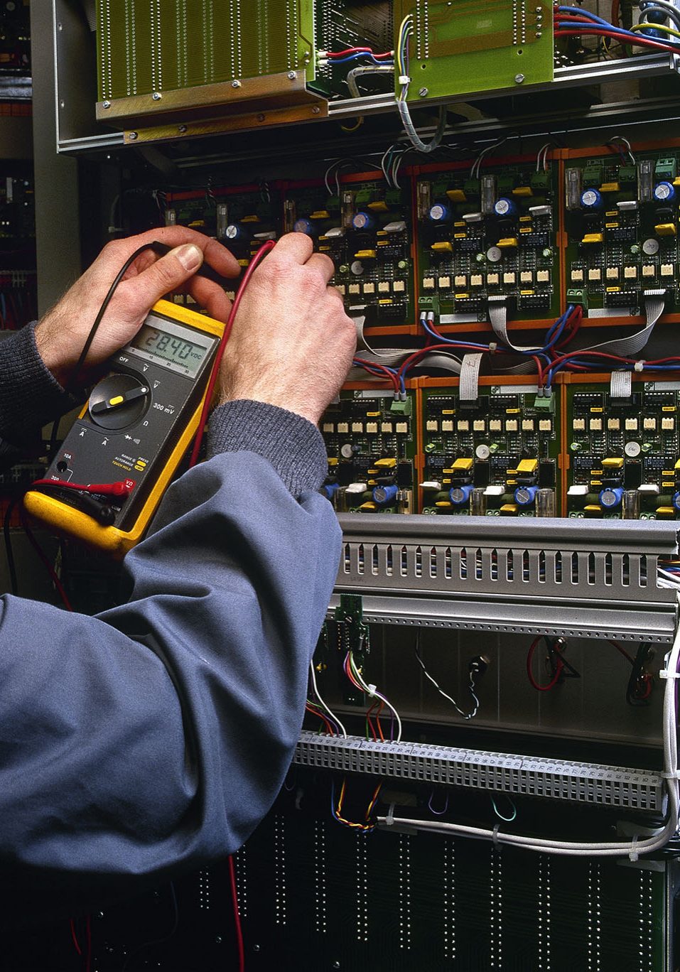 An image of a electrician testing some electrics